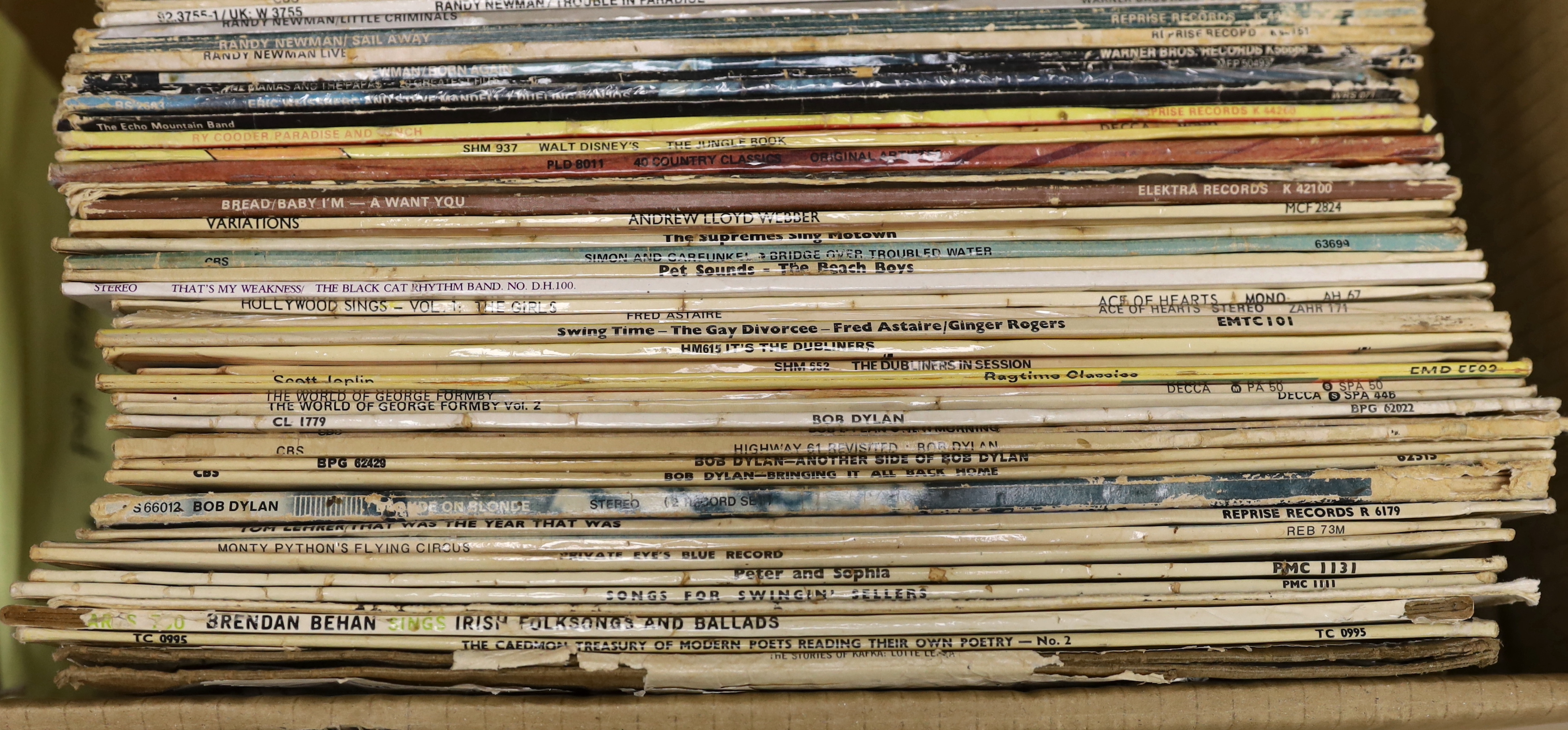 Fifty mainly 1970s LPs, including David Bowie, Leonard Cohen, Randy Newman, Bob Dylan, Simon & Garfunkel, and a number of comedy etc LPs, including Monty Python, Peter, Sellers, Private Eye, etc